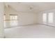 Large bedroom with vaulted ceiling, carpet, and French doors at 1010 Legacy Dr, Boulder City, NV 89005