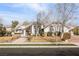 Single-story house with a large front yard, stone accents, and a three-car garage at 1010 Legacy Dr, Boulder City, NV 89005