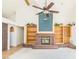 Living room with brick fireplace and ceiling fan at 1010 Legacy Dr, Boulder City, NV 89005