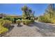 Landscaped backyard with gravel and desert landscaping at 10228 Questa Sera Ct, Las Vegas, NV 89135