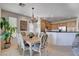 Charming dining room with a table and chairs near kitchen at 10228 Questa Sera Ct, Las Vegas, NV 89135