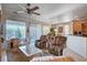 Living room with comfortable seating and view to dining area at 10228 Questa Sera Ct, Las Vegas, NV 89135