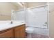 Clean bathroom, wood cabinets, bathtub, shower at 10540 Beachwalk Pl, Las Vegas, NV 89144