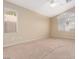 Spacious bedroom with neutral walls and carpet at 10540 Beachwalk Pl, Las Vegas, NV 89144