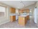 Kitchen with island and wood cabinets at 10540 Beachwalk Pl, Las Vegas, NV 89144