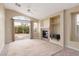 Living room with fireplace and sliding doors at 10540 Beachwalk Pl, Las Vegas, NV 89144