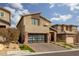 Two-story home with modern facade and landscaped yard at 10936 White Alder Pl, Las Vegas, NV 89138