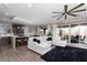 Bright, open-concept living room flowing into the kitchen and dining area with backyard access at 10936 White Alder Pl, Las Vegas, NV 89138