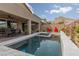 Relaxing pool area with patio furniture and mountain views at 10936 White Alder Pl, Las Vegas, NV 89138