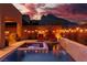 Stunning pool and spa area with mountain views and string lights at 10936 White Alder Pl, Las Vegas, NV 89138