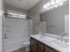 Bathroom featuring double sink vanity and shower-tub combo at 11106 Cherokee Landing St, Las Vegas, NV 89179