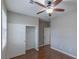 Bedroom with sliding closet door, hardwood floors, and natural light at 11106 Cherokee Landing St, Las Vegas, NV 89179