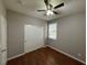 Secondary bedroom with wood-look floors and double door closet at 11106 Cherokee Landing St, Las Vegas, NV 89179