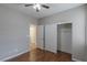 Bedroom with hardwood floors, ceiling fan, and ample closet space at 11106 Cherokee Landing St, Las Vegas, NV 89179