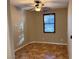 Well-lit bedroom featuring tile floors and a ceiling fan at 11106 Cherokee Landing St, Las Vegas, NV 89179