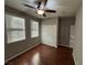 Bright bedroom with wood floors, ceiling fan, and double closets at 11106 Cherokee Landing St, Las Vegas, NV 89179