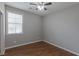 Bedroom with hardwood floors, a window, and neutral colored walls at 11106 Cherokee Landing St, Las Vegas, NV 89179