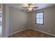 Home den with neutral walls, ceiling fan, and tile flooring at 11106 Cherokee Landing St, Las Vegas, NV 89179