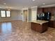 Open concept kitchen and living area with granite island at 11106 Cherokee Landing St, Las Vegas, NV 89179