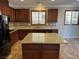 Kitchen with granite countertops and dark wood cabinets at 11106 Cherokee Landing St, Las Vegas, NV 89179