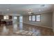 Spacious living area with tile floors, ceiling fan, and sliding doors to the backyard at 11106 Cherokee Landing St, Las Vegas, NV 89179