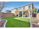 Artificial turf backyard with pergola and patio at 11157 Sandrone Ave, Las Vegas, NV 89138