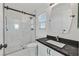 Bathroom with walk-in shower and dark vanity at 11157 Sandrone Ave, Las Vegas, NV 89138