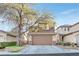 Two-story house with brown accents and a two-car garage at 11157 Sandrone Ave, Las Vegas, NV 89138