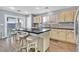 Kitchen with an island, light wood cabinets, and granite countertops at 11157 Sandrone Ave, Las Vegas, NV 89138