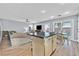 Kitchen with island, breakfast bar and view into living room at 11157 Sandrone Ave, Las Vegas, NV 89138