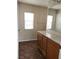 Bathroom with wood vanity, tile floor, and mirror at 11185 Saddle Iron St, Las Vegas, NV 89179