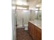 Bathroom with shower, toilet and wood cabinets at 11185 Saddle Iron St, Las Vegas, NV 89179