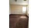 Spacious bedroom with brown carpet and large window at 11185 Saddle Iron St, Las Vegas, NV 89179