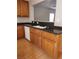 Kitchen with dark countertops and wood cabinets at 11185 Saddle Iron St, Las Vegas, NV 89179