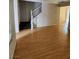 Living room with wood-look floors and staircase at 11185 Saddle Iron St, Las Vegas, NV 89179