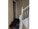 Staircase with white railing and brown carpeting at 11185 Saddle Iron St, Las Vegas, NV 89179