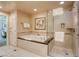 Bathroom with soaking tub, walk-in shower, and tiled floors at 125 E Harmon Ave # 1702, Las Vegas, NV 89109