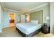 Spacious bedroom with king-size bed and access to bathroom at 125 E Harmon Ave # 1702, Las Vegas, NV 89109