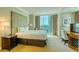 Luxurious bedroom with king-size bed, city view, and ensuite bathroom at 125 E Harmon Ave # 1702, Las Vegas, NV 89109