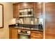 Modern kitchen with stainless steel appliances and breakfast bar at 125 E Harmon Ave # 1702, Las Vegas, NV 89109