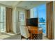 Home office with desk, chair, and large window with city view at 125 E Harmon Ave # 1702, Las Vegas, NV 89109