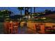 Outdoor patio with seating, fire pit, and string lights at 125 E Harmon Ave # 1702, Las Vegas, NV 89109