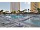 Resort-style pool and spa with lounge chairs and palm trees at 125 E Harmon Ave # 1702, Las Vegas, NV 89109