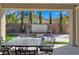 Covered patio with seating area, water feature, and fire pit at 12846 Ringrose St, Las Vegas, NV 89141