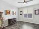 Bedroom with window shutters, dark gray vinyl flooring, and decorative accents at 12846 Ringrose St, Las Vegas, NV 89141