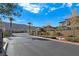 Gated community entrance with landscaping and mountain views at 12846 Ringrose St, Las Vegas, NV 89141