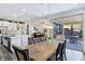 Dining area with view into kitchen and access to patio at 12846 Ringrose St, Las Vegas, NV 89141