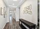 Bright entryway with gray wood-look floors and a console table at 12846 Ringrose St, Las Vegas, NV 89141