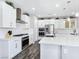 White kitchen with stainless steel appliances and subway tile backsplash at 12846 Ringrose St, Las Vegas, NV 89141