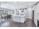 Modern kitchen with white cabinets, large island, and stainless steel appliances at 12846 Ringrose St, Las Vegas, NV 89141